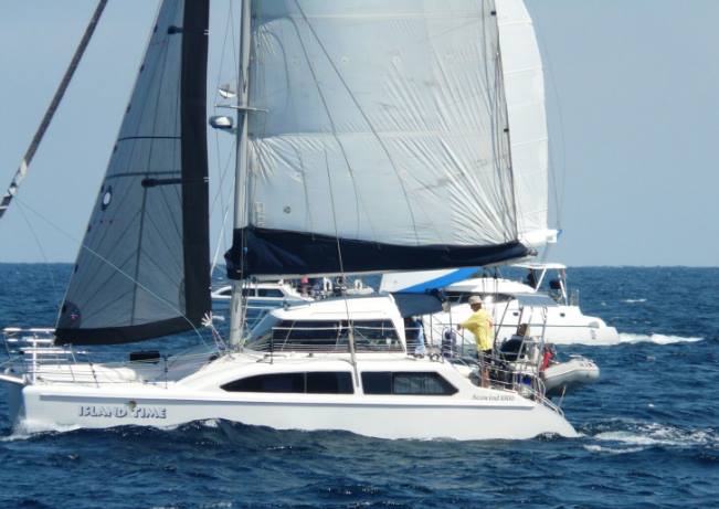 Larry Robertson single hands his Seawind 1000 catamaran to victory